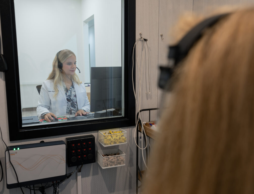 Person in a hearing booth