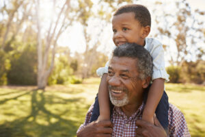 Grandfather Carrying Child