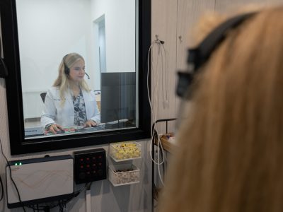 Person in a hearing booth