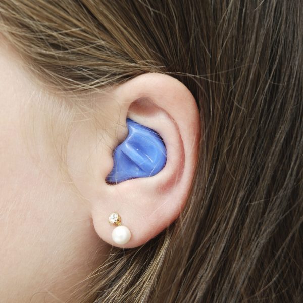 "Girl with a custom made silicon ear-plug, medical protection against ear infection caused by contact with water.More Hearin-Helth related files at:"